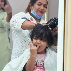 This little rockstar is having a blast during her haircut. We love the energy and joy our youngest clients bring to the salon.