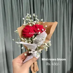 Sometimes, the smallest gifts make the biggest impact. This mini bouquet features two delicate red roses paired with baby's breath, all wrapped and ready to give as a sweet, thoughtful gesture.