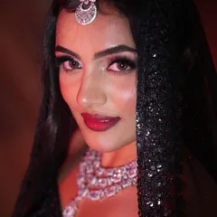 For a glamorous reception or cocktail party, nothing beats the sparkle of a diamond and CZ set. This close-up shows the intricate details and brilliant shine of a multi-layered necklace and matching maang tikka.