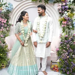 Anupa and Abhishek at their engagement, looking serene in pastel shades. I designed his simple white kurta with a matching pastel blue Nehru vest to coordinate with her stunning mint green and silver lehenga.