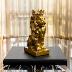 A symbol of power and grace, this geometric golden lion with a crown is a must-have for a modern, luxe coffee table. Its sharp lines and bold finish make a strong statement.