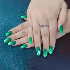 Another view of a student's work, highlighting the smooth finish and consistent shaping of the oval nails. We focus on teaching the fundamentals of nail technology for a professional look.