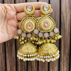 Beautifully crafted gold-plated jhumkas with delicate pink enamel work and pearl drops. A very feminine and elegant choice.