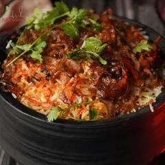 Behold our famous Handi Biryani. This isn't just a dish; it's an experience. We layer fragrant basmati rice with fresh vegetables and aromatic spices, slow-cooking it to perfection to create a healthy version of this classic comfort food.