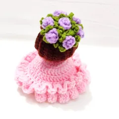 This reversible bouquet doll is two gifts in one. It starts as a beautiful floral bouquet and flips inside out to reveal an adorable doll in a pink frilly dress with a flower crown.