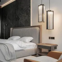 Perfection in simplicity. This bedroom design features our custom bed with a vertically channeled grey headboard and a matching wood-finish frame, creating a calm, contemporary, and sophisticated look.