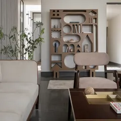 Even restraint can have character. In our compact Hikari House project, we designed this sculpted bookshelf from waste wood, turning leftover material into an interactive feature that brings a touch of whimsy and proves that resourcefulness can be expressive.