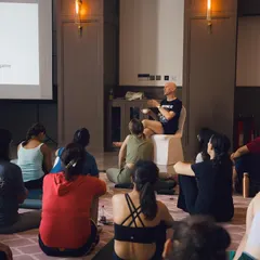 A lecture segment during a wellness workshop, where we explore the science behind stress and yoga. I believe in providing not just the practice but also the knowledge, so participants understand how these tools work.