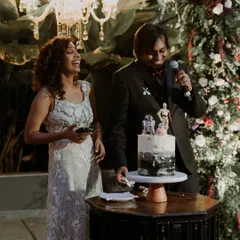 The couple shares a laugh while cutting their unique Star Wars themed wedding cake, a perfect example of how we personalize every detail.