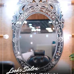The centerpiece of our makeup station is this beautifully ornate mirror. It's where the magic happens, providing perfect lighting for our artists to craft your flawless look.