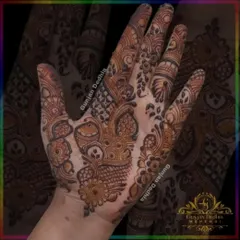 A beautiful example of Indo-Arabic design. This style combines the bold lines and floral motifs of Arabic mehendi with the intricate fillers of Indian patterns.