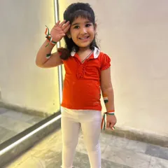 Another one of our little stars saluting the flag with a big smile. We prepare kids for school functions and community events for all national holidays.