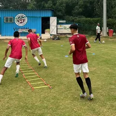 The agility ladder is a fundamental tool for improving footwork and coordination. Here, players work on quick feet drills, a key component of our speed and agility training program.