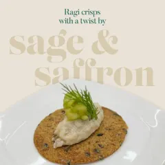 A simple yet elegant presentation of a ragi crisp topped with a creamy spread and garnished with fresh dill and cucumber. This highlights the versatility of the humble ragi crisp.