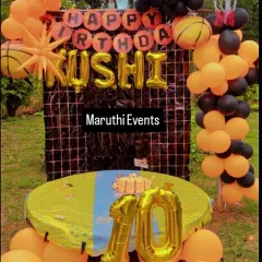 A slam dunk of a party with this basketball theme. The orange and black decor includes basketball-shaped balloons, a net prop, and a large number "10" for the birthday boy.