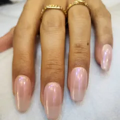The viral glazed donut look. We achieve this beautiful, iridescent chrome finish over a soft, milky white base for a manicure that is trendy yet timeless.