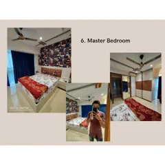 A glimpse into a master bedroom design. The room features a bed with a custom upholstered headboard, a bold accent wallpaper, and a sliding wardrobe with a mix of wood and white finishes.