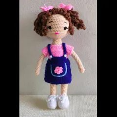 I love making curly hair for my dolls. This one has beautiful brown curls and a cute denim-style dress. Her shoes can be taken off too.