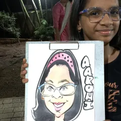 A young girl happy with her colorful caricature from a flea market event. I love seeing the excitement in kids' eyes.