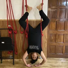 Wall ropes are fantastic for inversions like this supported headstand (Shirshasana). They help decompress the spine and build upper body strength without putting pressure on the neck, making it a safe way to get upside down.