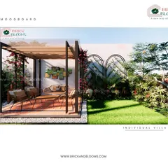 Another view of our backyard design, highlighting the use of arched trellises on the wall for climbing plants. This adds vertical interest and a touch of classic garden elegance.