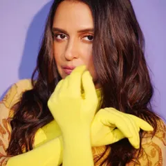 A close-up portrait that highlights the contrast between the soft, wavy hair and the sharp, vibrant color of the gloves. This shows my focus on creating a complete, cohesive mood.