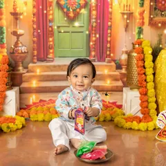 Look at this little sunshine enjoying our special Diwali setup! I love creating these festive mini-sessions, complete with colorful decor and props, to make your celebrations truly unforgettable.