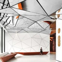 Inside the Parinee I Tower lobby, a triangulated mirrored ceiling transforms the space into an ever-evolving kaleidoscope. This immersive design reflects movement and light, creating a dynamic arrival experience that blurs the line between architecture and art.