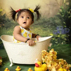 Look at that expression of pure wonder. The bath portion of a one-year-old photoshoot often brings out the most delightful and surprised faces.