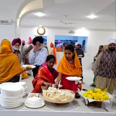 A delightful breakfast spread for a Baraat at a Gurudwara in Ulsoor. Guests are enjoying simple yet elegant offerings like sandwiches and dhokla before the wedding festivities begin.