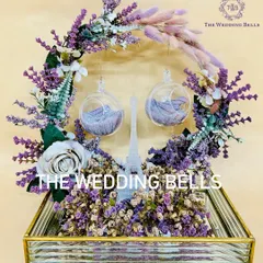 The complete Paris-themed engagement ring platter, set in a mirrored gold tray and adorned with a wreath of lavender flowers.