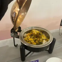 A close-up of my copper-finish chafing dish, holding a delicious vegetable biryani. This serveware not only looks great but also keeps the food perfectly warm.