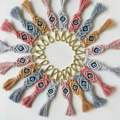 A closer look at the detail in my evil eye macrame keychains. The combination of intricate knots and pastel threads makes them a stylish and meaningful gift for any occasion.