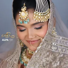 This close-up highlights the soft pink eyeshadow and the gentle contouring, creating a look of pure elegance for a Muslim bride.