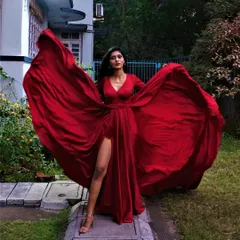 Create unforgettable photos with our dramatic flying gowns. This liquid silk red gown with a high slit and a massive trail is a favorite for pre-wedding shoots and making a statement.