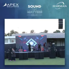 A band performs a soundcheck on a stage flanked by stacks of JBL speakers. We provide the complete audio infrastructure for live demonstrations, allowing brands to showcase their products in a real-world setting.