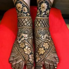 This is a duplicate of image 13. A breathtaking full-foot bridal design with bold, dark lotus and floral motifs. The intricate patterns and sharp contrast create a truly show-stopping look.