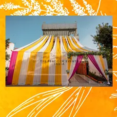 I can transform any space for your celebrations. Here, I used vibrant yellow, white, and pink drapes to create a grand and festive tented entrance for a Haldi ceremony held at a private residence.