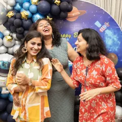 Candid laughter among friends at a birthday party. I always keep an eye out for these genuine moments of connection between guests.