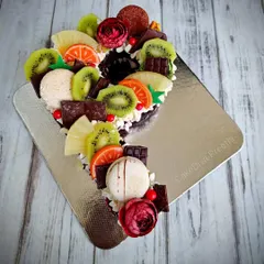 Just when I thought monogram cakes were no longer in trend! This 'P' shaped cake is loaded with fresh fruits, chocolate, and macarons.