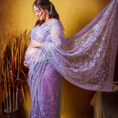 For those who love a traditional look, a maternity shoot in a beautiful saree is a timeless choice. This portrait highlights the intricate details of the fabric and the radiant glow of motherhood.