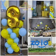 This collage showcases the 8th-anniversary decorations for Zolostays. I used their brand-adjacent colors, yellow and blue, throughout the office, from the entrance with a large foil number '8' to the ceiling decor over the workstations.