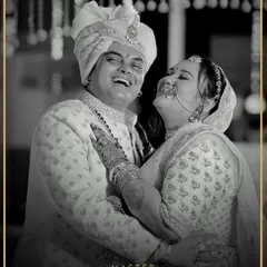 There's nothing more rewarding than seeing a groom beaming on his wedding day. Here, our client Mihir looks joyous and regal in a custom-designed off-white sherwani, perfectly capturing the happiness of the moment.
