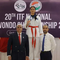 Standing beside my student on the winner's podium at the 20th ITF National Championship. This is what dedication and rigorous competition prep leads to.
