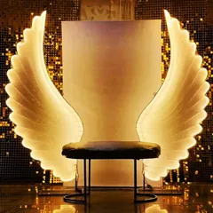 I can definitely get you wings. This photo seat with glowing angel wings is a crowd favorite, creating a heavenly photo opportunity that makes everyone feel like a star.