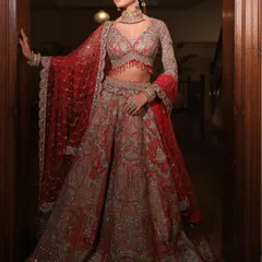 A grand entrance in a traditional red and silver lehenga. I styled this look to feel majestic and powerful, with full-sleeved embroidery and a flowing silhouette perfect for a royal wedding.