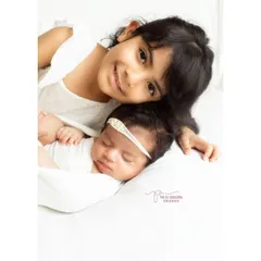 The sweet bond between sisters, starting from day one. Capturing the gentle curiosity and love of an older sibling is one of the most special parts of my job.
