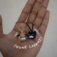 Tiny phone charms are back in style! Here are cat and dog head charms, perfect for adding a bit of personality to your phone.