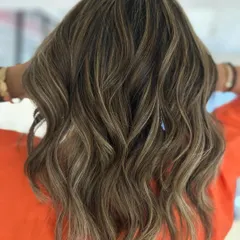 Hello summer. This beach blonde look was created with back-to-back foils for maximum brightness, resulting in a beautiful, textured balayage.