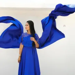 Here is another look at the royal blue rental gown, showing how the wings can be styled to look like they are taking flight.